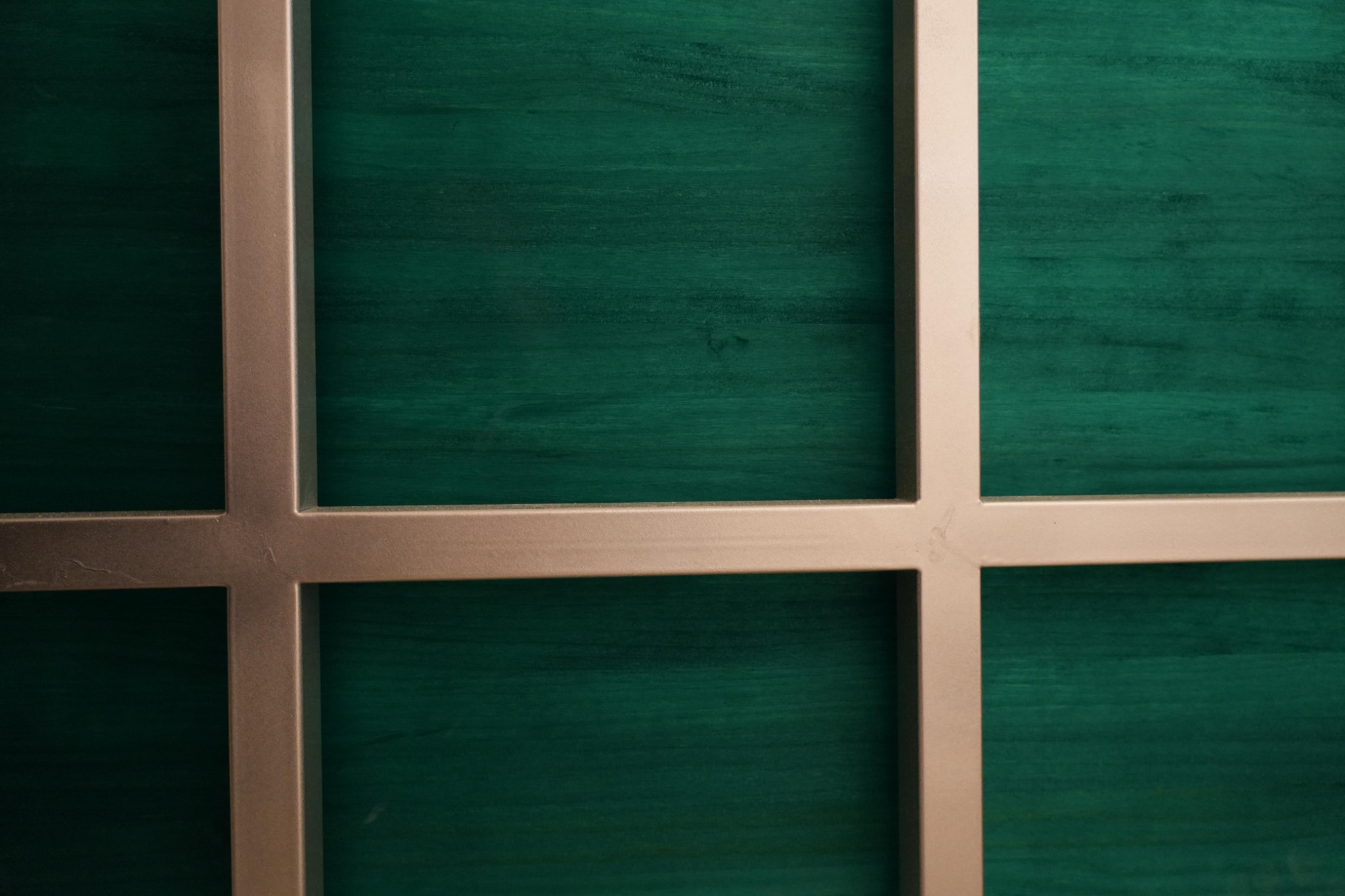 Baan Thai Canteen construction: green infill panels in the timber grid
